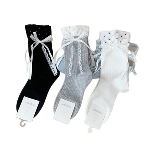 Lace bowknot crew socks in black, grey, and white with polka dot ruffle edges