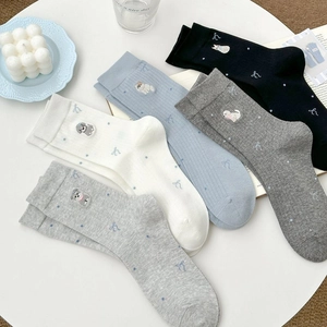 Cinq paires de chaussettes en coton avec broderies d'animaux et motifs de nœuds doux