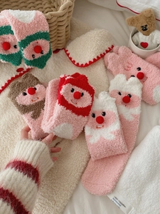 Detailed close-up of colorful coral fleece beaver socks for women in warm autumn colors