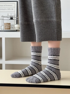 Close-up of grey coral fleece striped socks showing soft texture for home wear