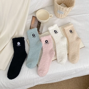 Detail of five pairs of floral coral fleece socks with pearls and Beautiful embroidery