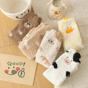 Fuzzy coral fleece thermal socks featuring cute embroidered cartoon animal patterns