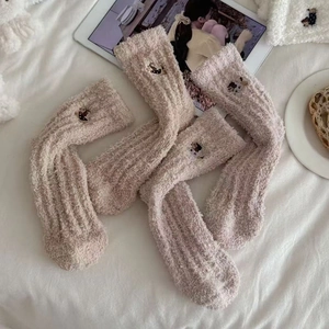 Detailed view of warm coral fleece mid-tube socks with cute cat embroidery decor