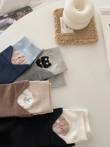 Detailed knit of cotton mid-calf socks featuring cute embroidered animal patches