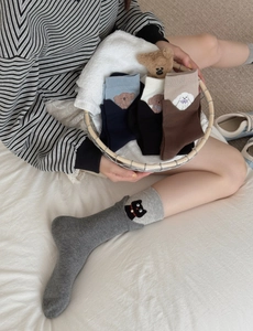 Detail of cute cat and dog embroidery on colorful cotton crew socks for women