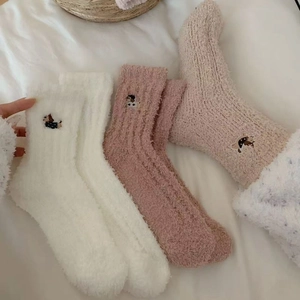 Three pairs of coral fleece socks with dog embroidery in white, pink and beige