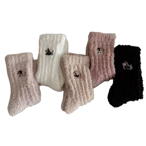 Five pairs of plush coral fleece crew socks with dachshund dog embroidery in varied colors
