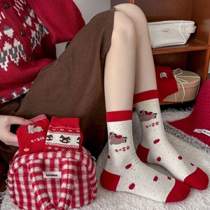 Detail of red festive Year of the Horse socks with auspicious patterns and knit textures
