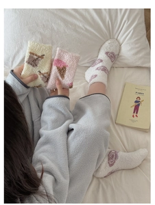 Detail of coral fleece thick socks in pastel colors with cute ice cream patterns