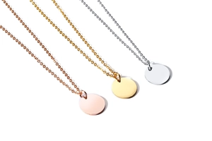 Three minimalist round disc pendants in gold, rose gold and silver finishes with chains