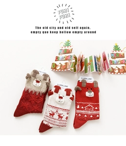 Three-pair Christmas crew sock set featuring reindeer patterns and 3D ears detail