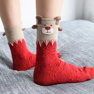 Festive red Christmas socks with 3D reindeer ears and snowflake knit patterns