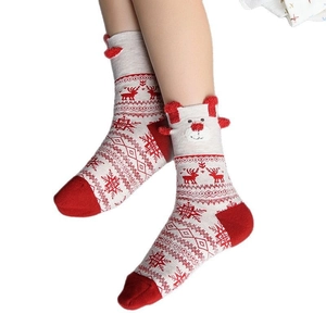 Christmas reindeer mid-calf socks in red and white with festive 3D pom-poms and snowflake patterns