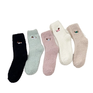 Five pairs of winter coral fleece dachshund socks in assorted soft pastel colors