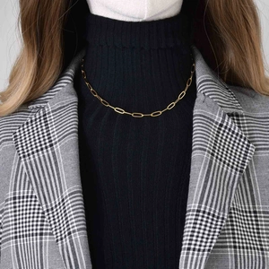 Golden stainless steel paperclip link chain necklace worn on model for minimalist style