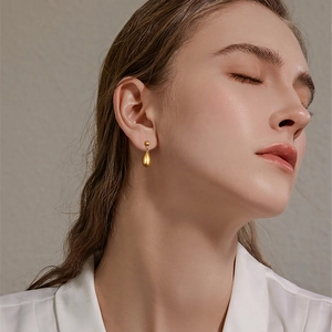 Elegant gold teardrop earrings for women in a minimalist stainless steel design