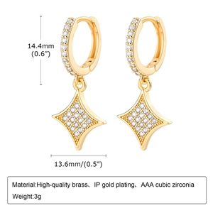 Macro detail of gold-plated brass star earrings showing 14.4mm size and AAA zircon stones