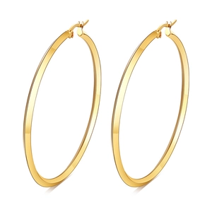 Minimalist large polished gold hoop earrings with secure closure on white background