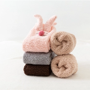 Cozy coral fleece bunny slipper socks in pink, grey, and khaki for autumn and winter