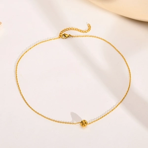 Gold stainless steel chain necklace featuring a textured round bead pendant and lobster clasp