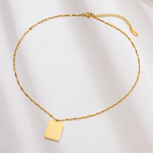 Detail of gold stainless steel necklace with checkered square pendant and lobster clasp