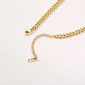 Detail of 18K gold stainless steel bar chain with lobster clasp and K18 tag