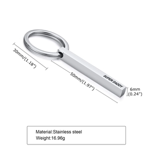 Macro view of stainless steel keychain with Super Daddy engraving and size markings
