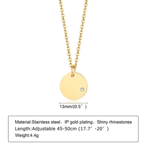 Golden stainless steel necklace with a 13mm round brushed pendant featuring a rhinestone
