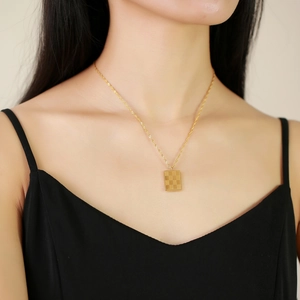 Golden stainless steel checkerboard rectangle pendant necklace for women on neck