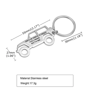 Detailed view of SUV-shaped stainless steel keychain with Drive Safe engraving