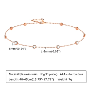 Detail of rose gold stainless steel chain with round AAA cubic zirconia bezel charms