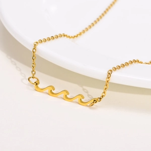 Minimalist gold wavy pendant necklace for women with elegant triple wave sea-inspired design