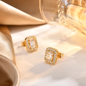 Detailed close-up of gold geometric square stud earrings featuring zircon pavé setting