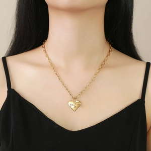 Golden heart lock necklace with LUCKY engraving and zircon on a long link chain