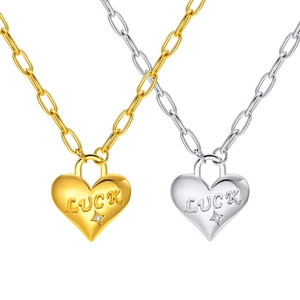 Luck heart pendant necklaces in gold and silver with paperclip chains and zircon detail