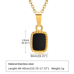 Detail of gold stainless steel necklace with black rectangular pendant and beaded edges