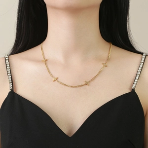 Gold stainless steel star necklace with zircon inlays shown on model for high-end look