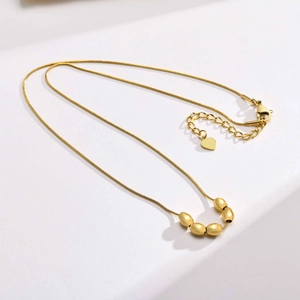 Minimalist gold stainless steel snake chain necklace with five oval bead pendants