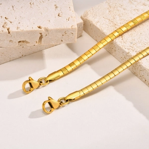 Golden stainless steel snake chain necklace with hammered texture and lobster clasp