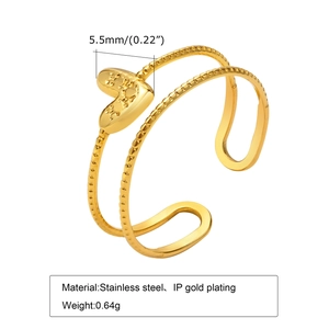 Gold stainless steel wrap ring featuring a textured heart charm and open adjustable design