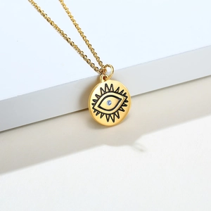 Collier en acier titane doré avec pendentif œil et cristal de zircone bleu clair