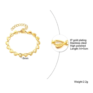 Detailed view of gold stainless steel heart link bracelet with size and material specs