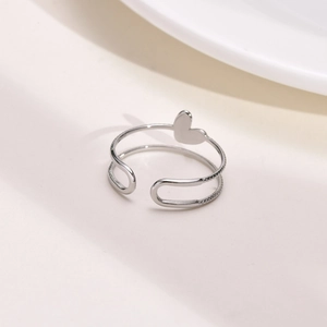 Detail of silver double-layered open heart ring with micro-pave cubic zirconia crystals
