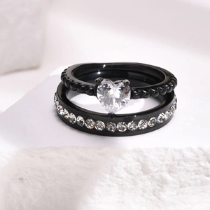 Black titanium ring set with heart-shaped cubic zirconia and bead texture details