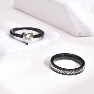 Black titanium eternity band set with heart shaped zircon on textured white stone