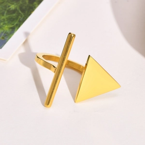 Detail of minimalist gold triangle open ring showing geometric design and polished finish