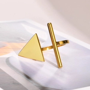 Detailed view of a golden geometric triangle open ring with polished stainless steel finish