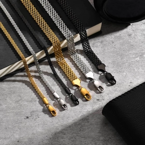 Mesh chain bracelets in gold silver and black with lobster clasps shown with accessories