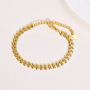 Polished gold stainless steel wheat chain bracelet with lobster clasp and K18 tag