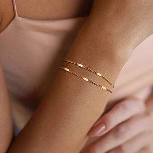 Minimalist double layer gold chain bracelet for women featuring textured rectangle charms